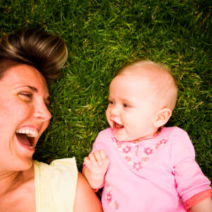 A baby girl and mom in the garden.