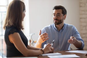 2 people in a meeting